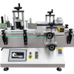 Etiquetadora automática de sobremesa para envases redondos – máquina compacta para etiquetar botellas, frascos y tubos cilíndricos.